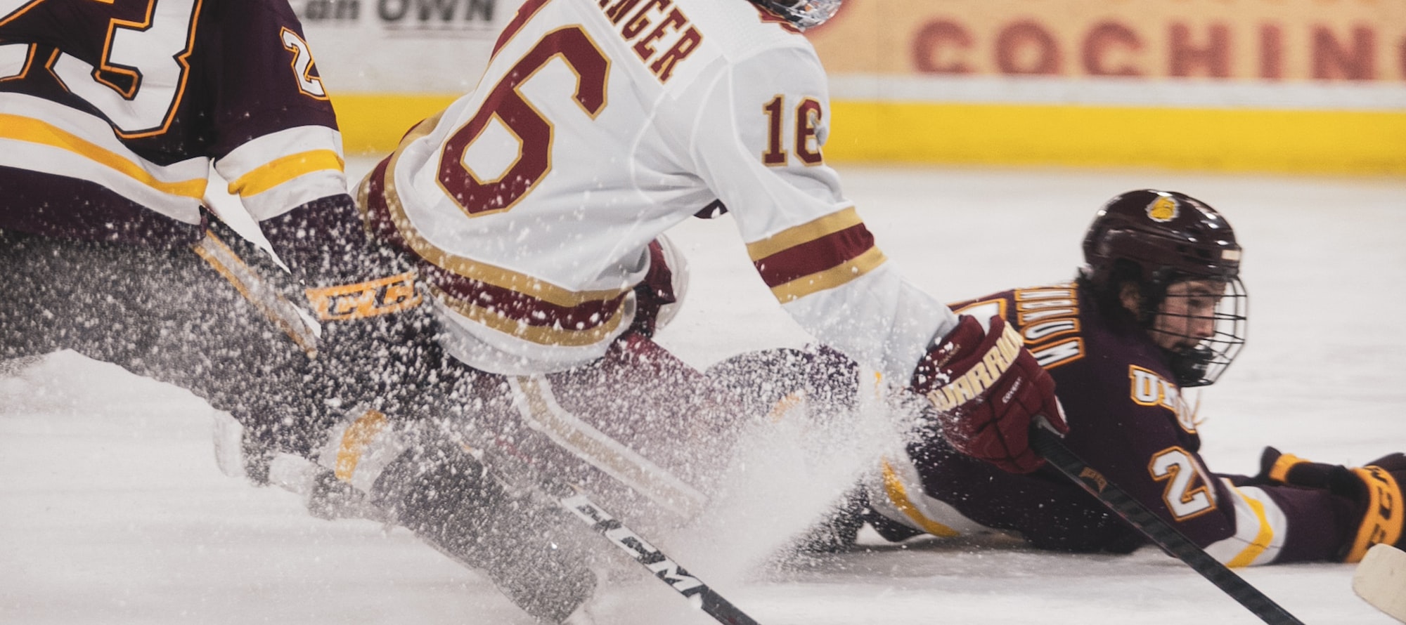 A youth hockey player on the ice in a fully matched kit, jersey socks and shell reading as one uniform