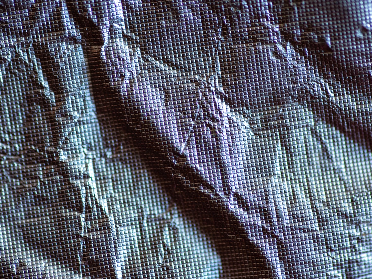 Macro of a coated technical lining fabric, creased, with no marks or labels on it