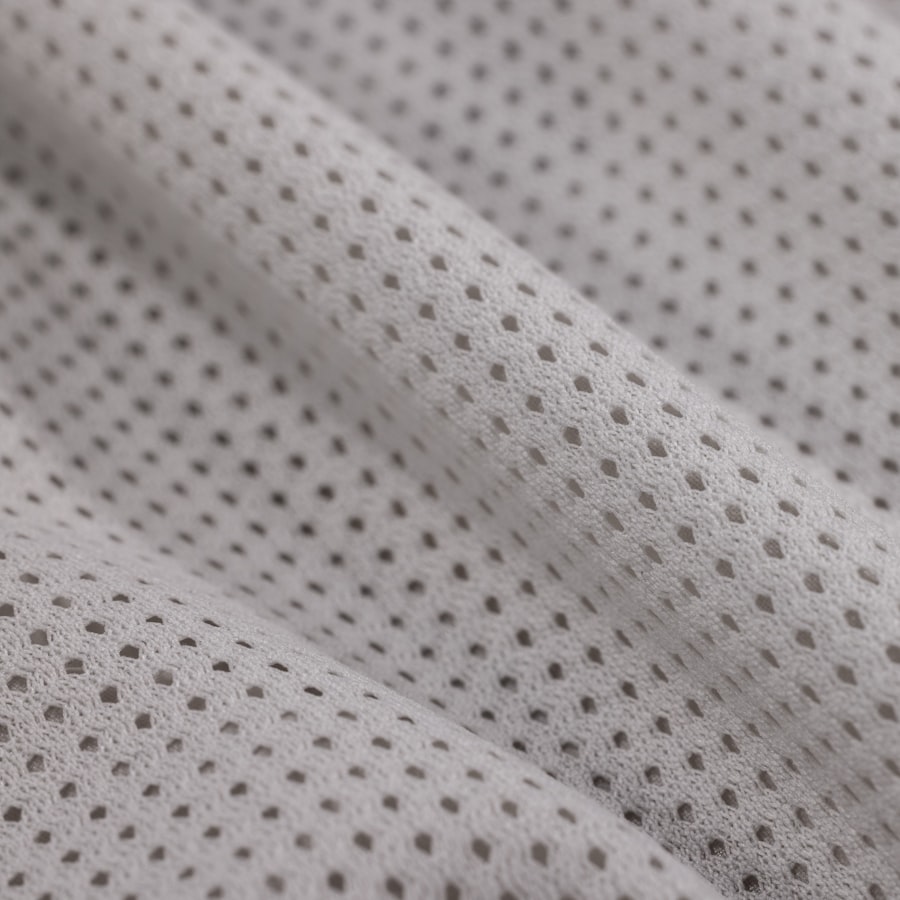 Close-up of a lightweight high-mesh-ratio performance fabric swatch
