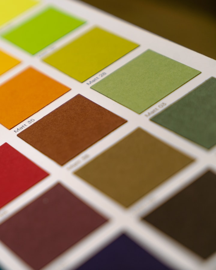 The kit's single approved color reference: a fanned set of color swatch cards signed off at sampling, no readable brand names, no logos