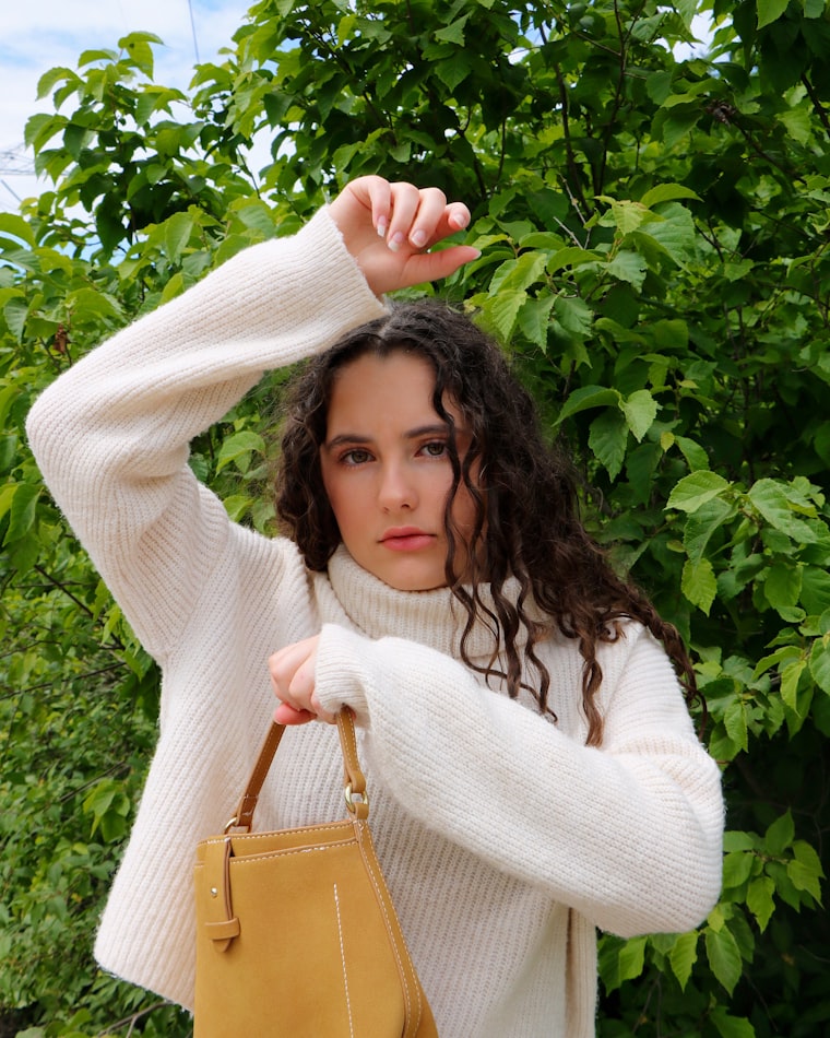 Discreet fashionable personal alarm for women hanging as a charm on a handbag